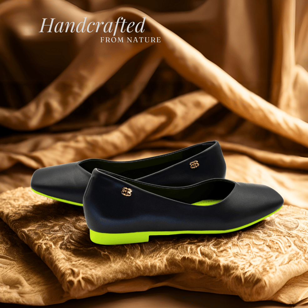 Introducing the avarerarth Nature Muse eco friendly ballerinas, handcrafted with natural elements for sustainable fashion. These chic black flats feature vibrant neon green linings and soles, embodying our eco-conscious approach to footwear.